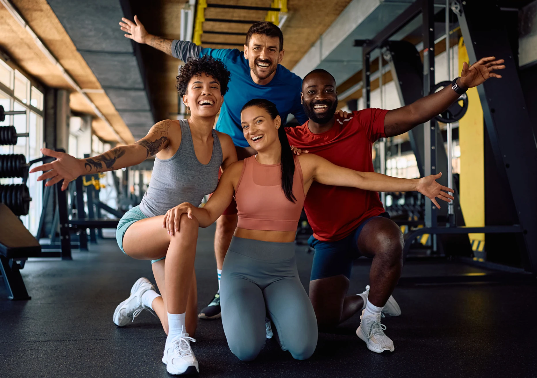 Group of friends smiling at gym