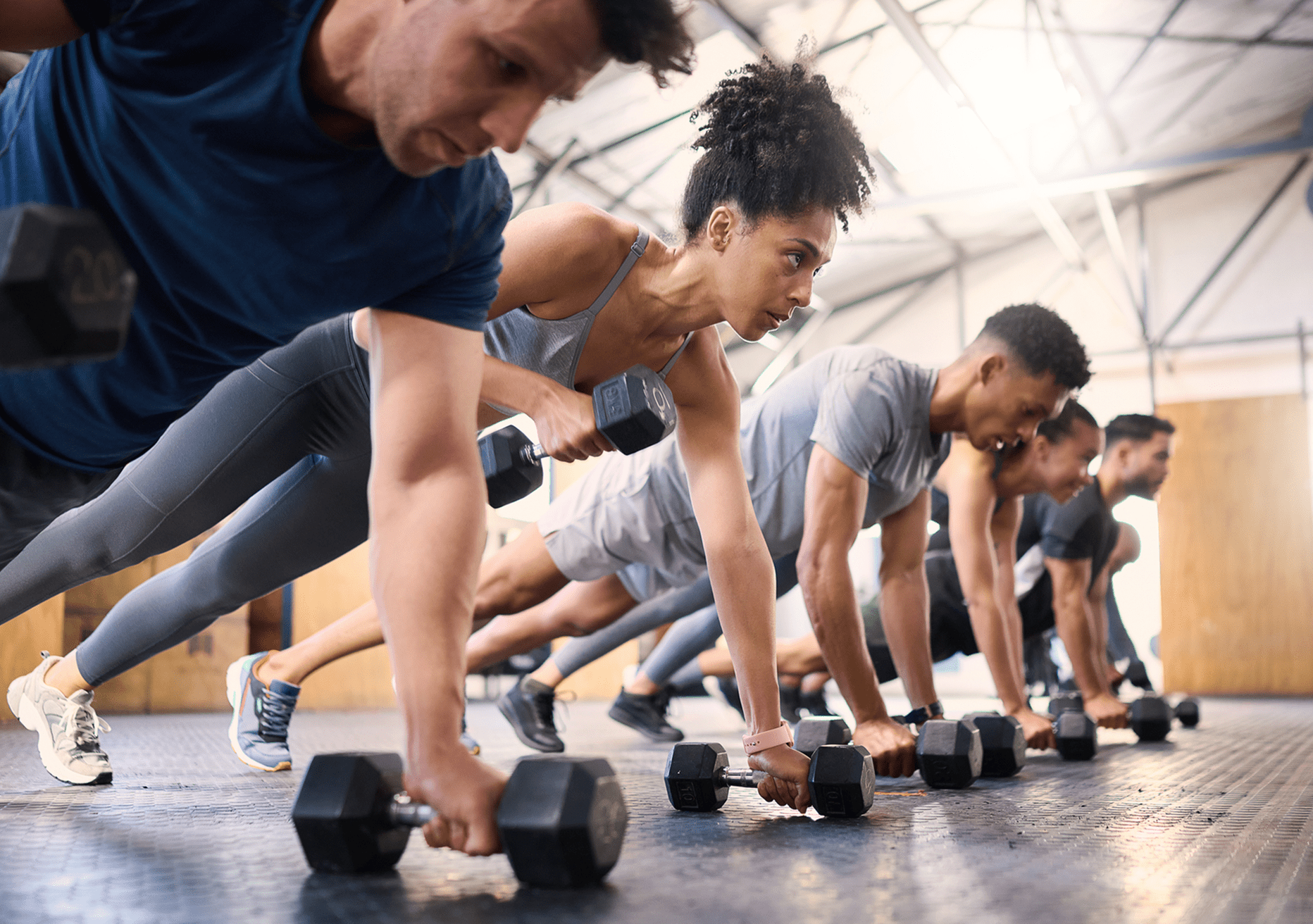 Fitness class performing push-up exercise