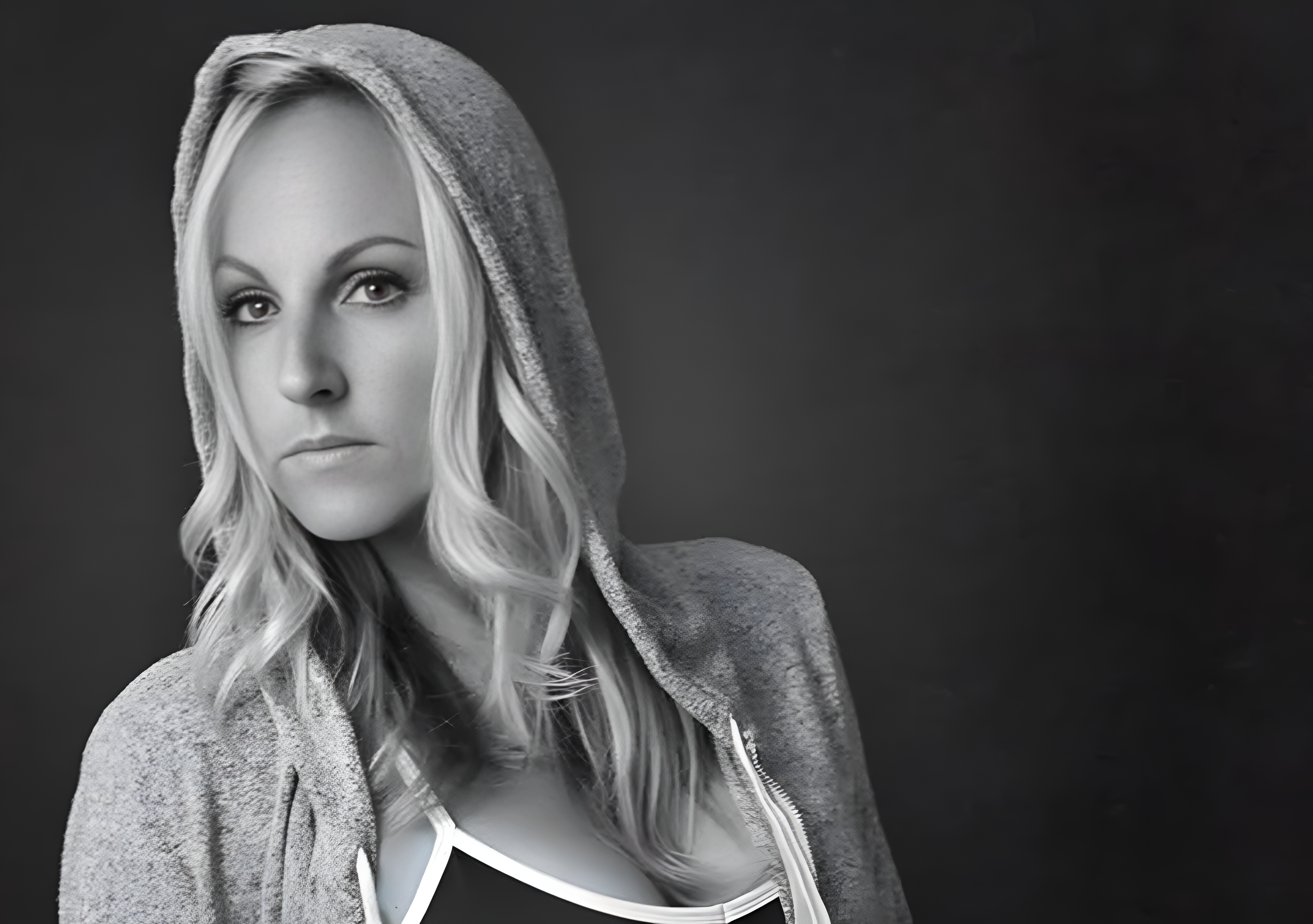 Woman in hoodie, black and white portrait